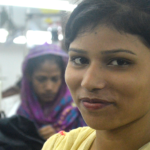 Factory worker smiling at the camera