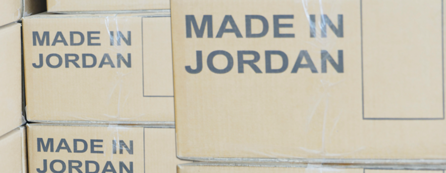Stacks of cardboard boxes marked 'Made in Jordan'