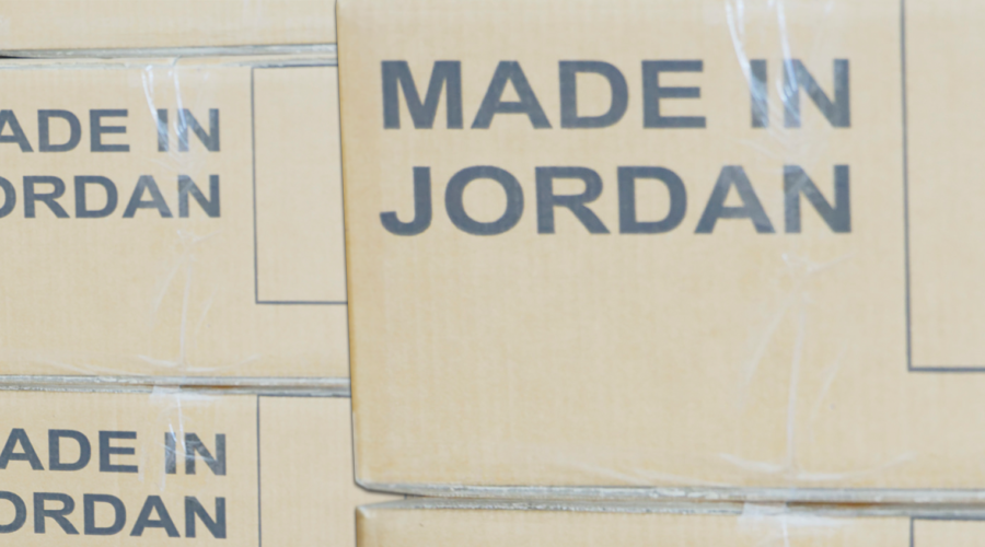 Stacks of cardboard boxes marked 'Made in Jordan'