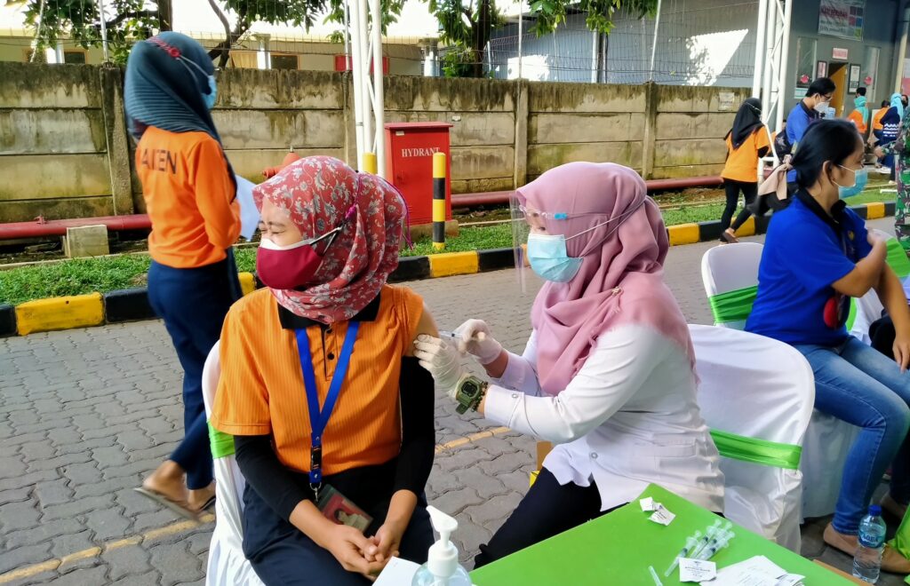 When COVID-19 vaccines were first available in early 2021 in Indonesia, Human Resource Supervisor Eltruidis Widyarsanti had to scramble to secure vaccines for the hundreds of employees at the garment factory she oversaw in Semarang, Central Java.